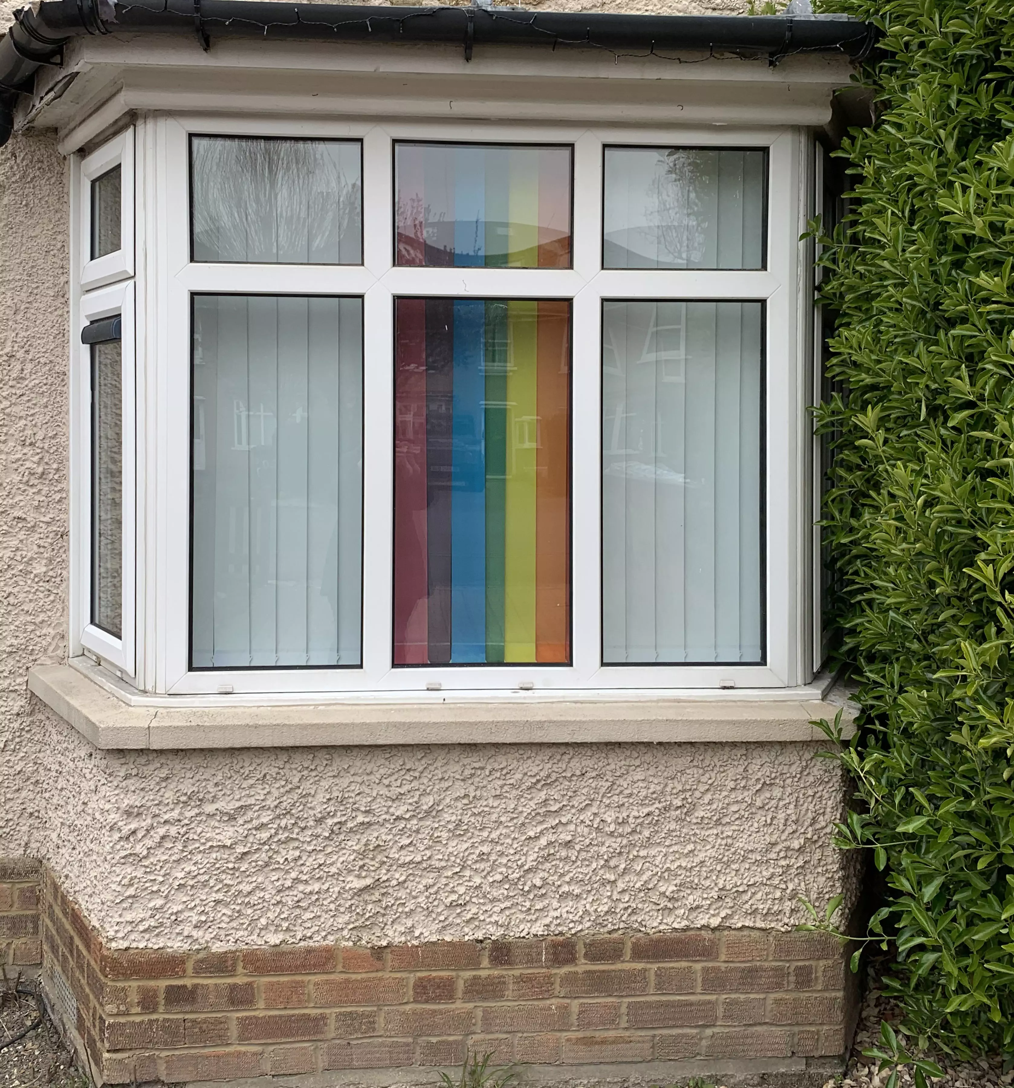 The rainbow blinds look amazing from the outside (