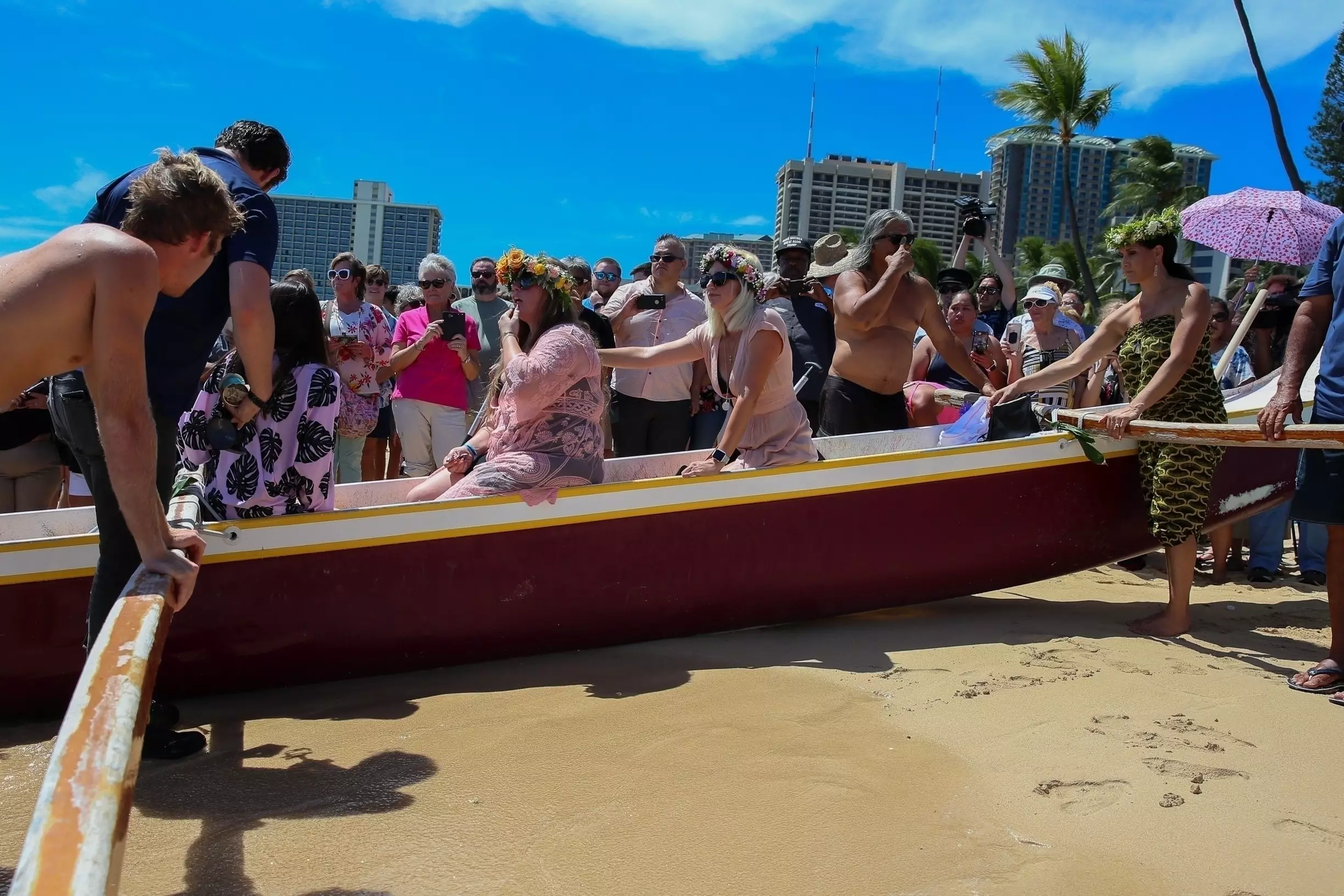 Mourners attended the memorial which was held on a beach in Hawaii.