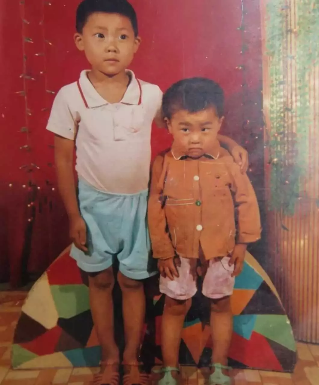 Mr Hao, right, was only eight years old when he was abducted.