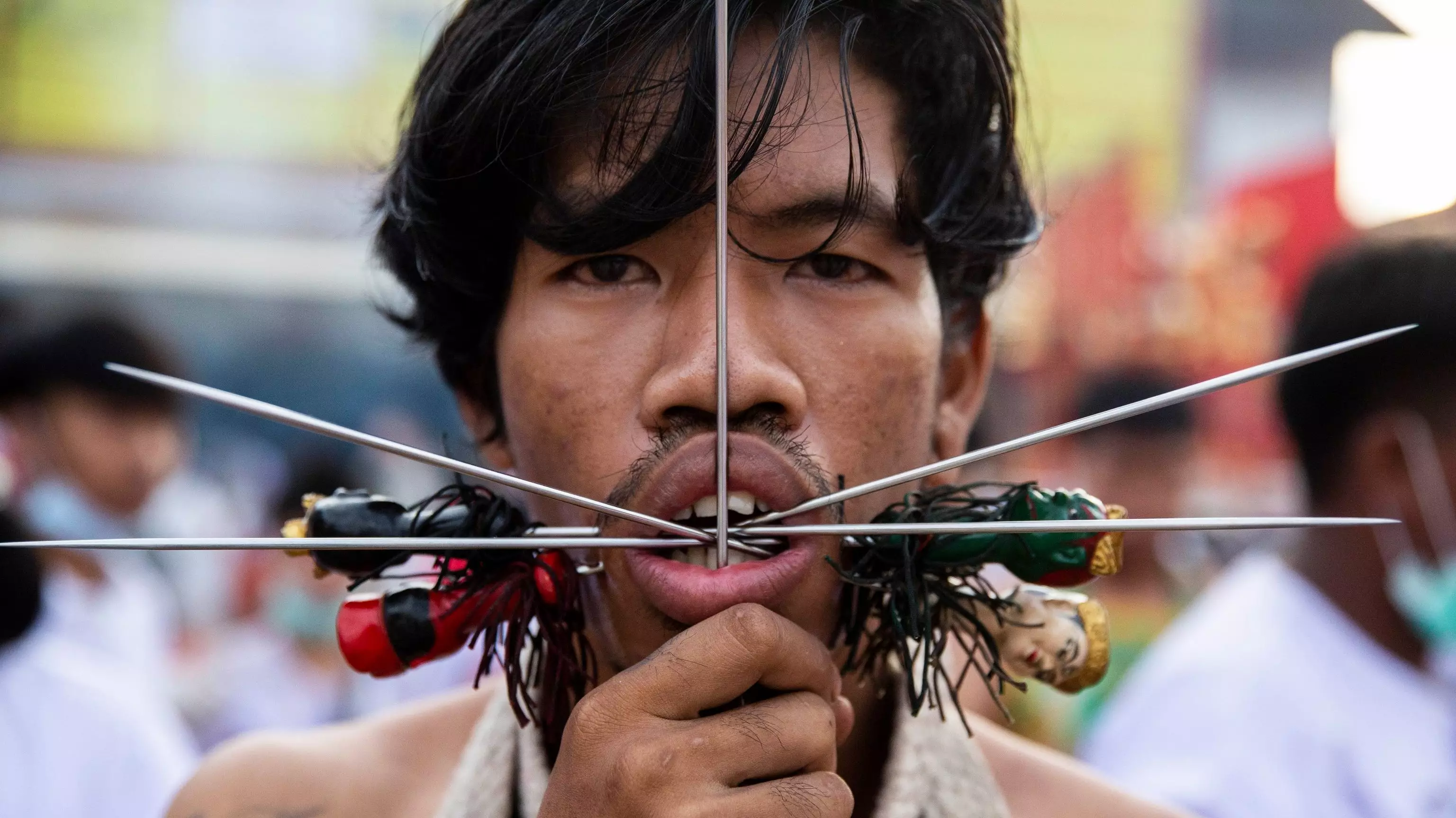 Worshippers Pierce Faces With Metal Spikes And Axes At Thai Vegetarian Festival
