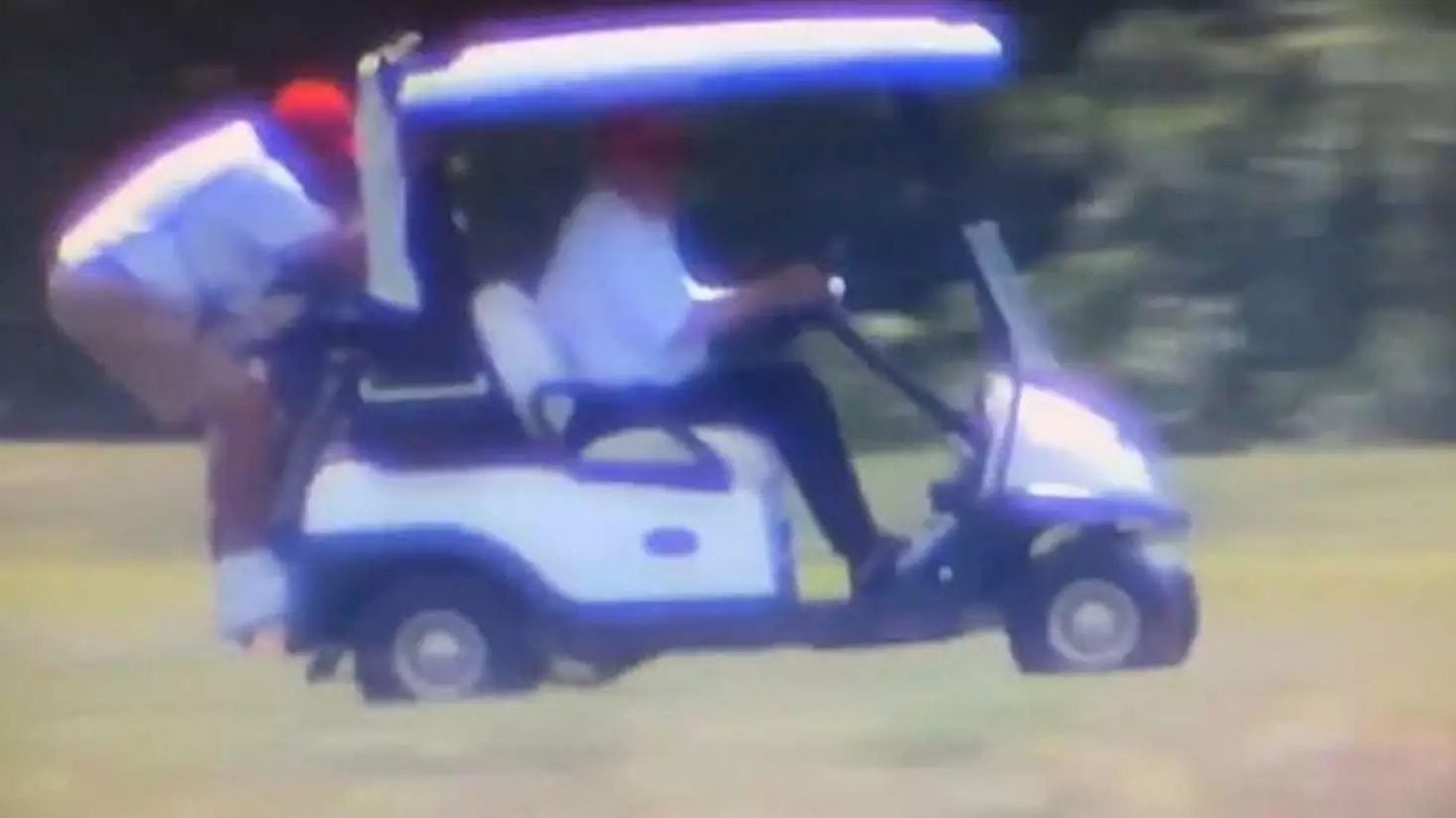 Donald Trump Drives Golf Cart With Caddie Hanging Off The Back