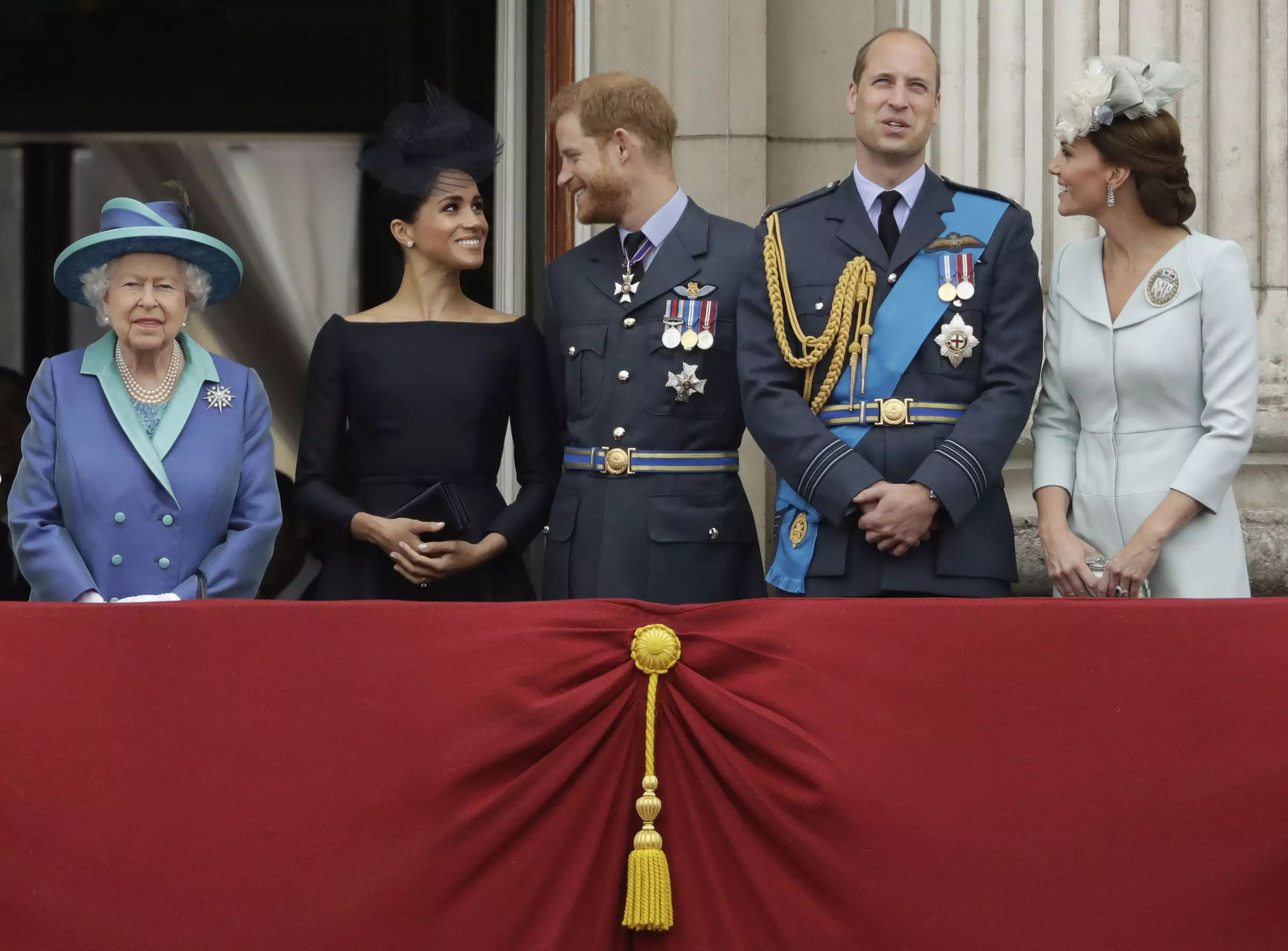 Queen Elizabeth II, and from left, Meghan the Duchess of Sussex, Prince Harry, Prince William and Kate the Duchess of Cambridge.