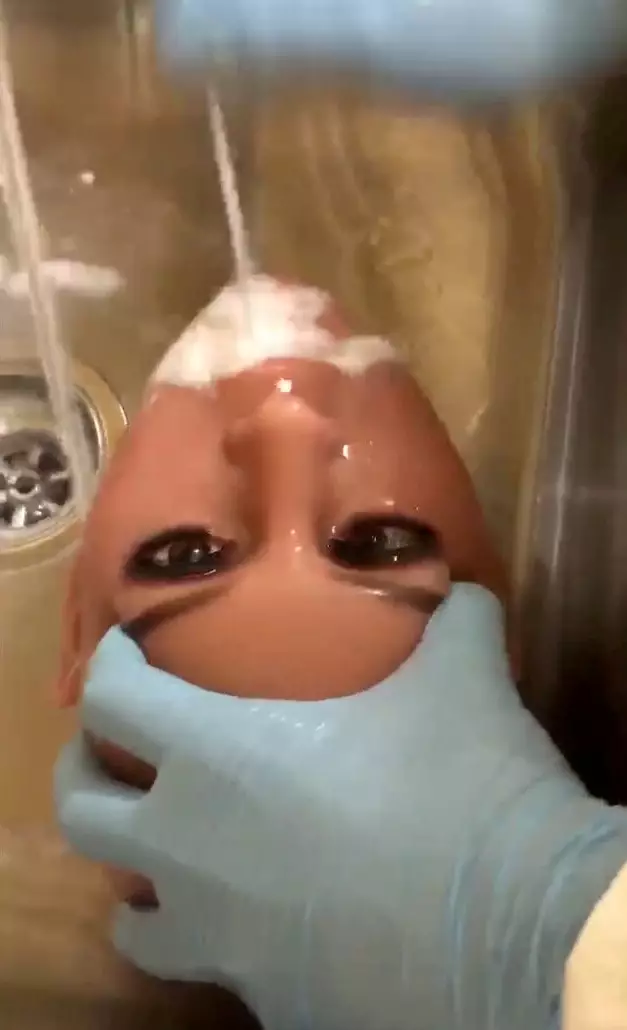 A doll quite literally having her mouth washed out.