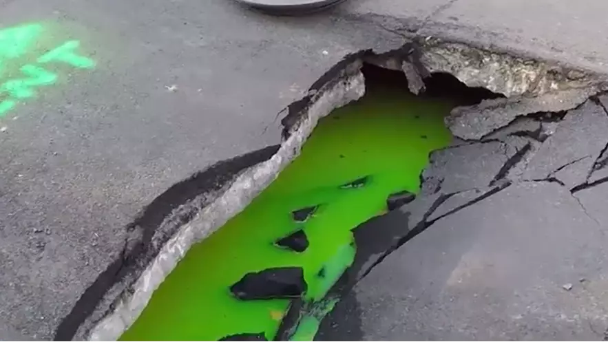 Huge Sinkhole Oozes Bright Green Liquid In Canada Street