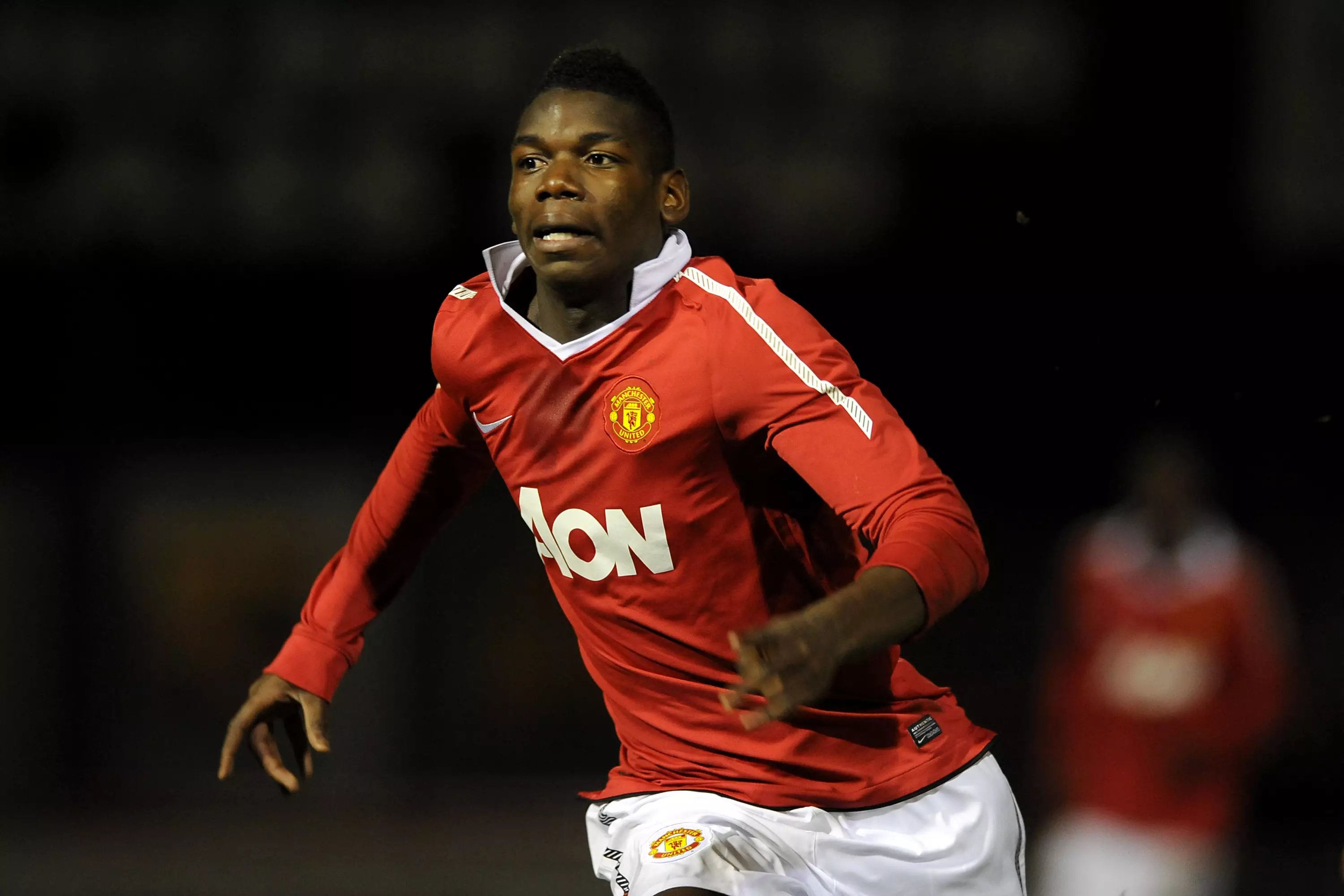Pogba playing for the club's youth team during his first stint at United. Image: PA Images