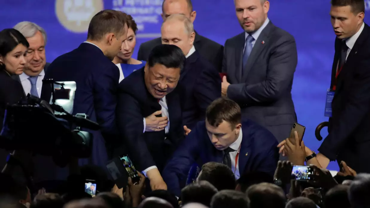 ​Security Officials Grab China’s President Xi As He Stumbles On Stage In Russia