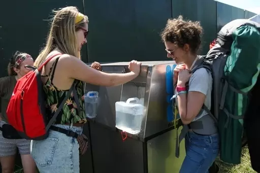 Festival goers refilling their water bottles on the first day of the Glastonbury Festival.