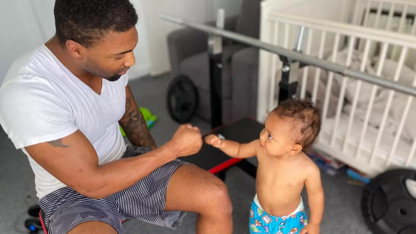 Personal Trainer Slammed For 'Dangerously' Performing Bench Presses Over Baby Son