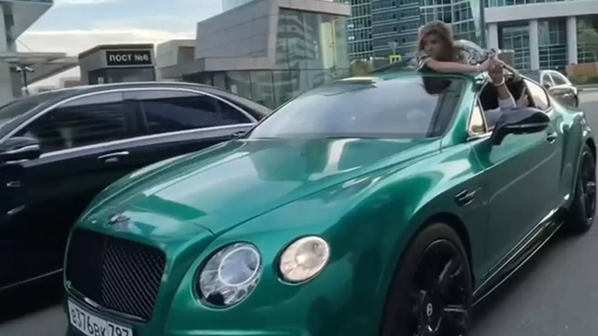 Influencer Drives With Girlfriend On Roof Handcuffed To Him In 'Trust Test' Stunt