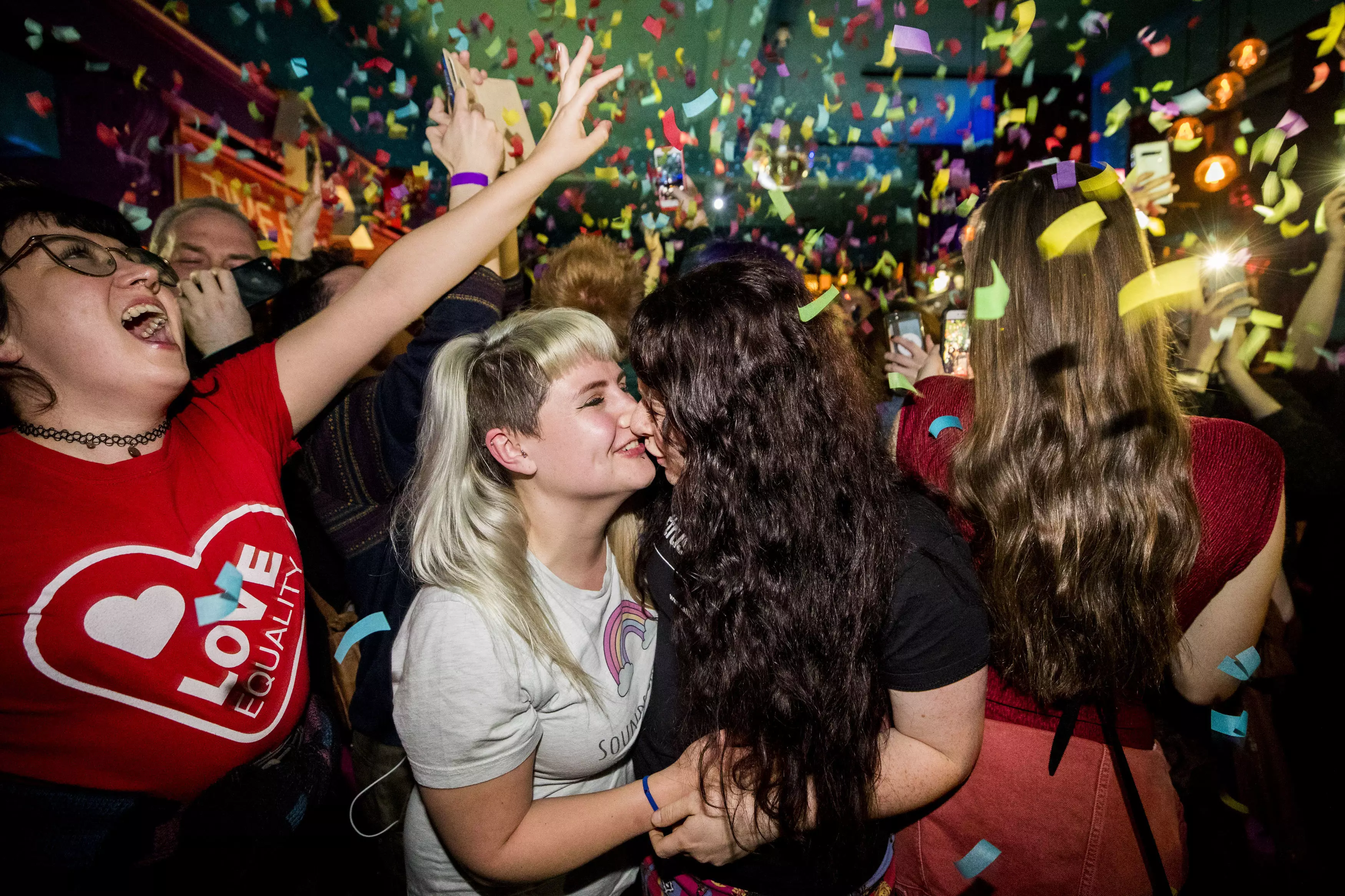 A couple celebrating the legalisation of same sex marriage at midnight in Belfast. (