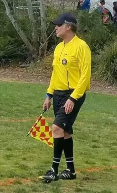 Ferrell volunteering as a referee.