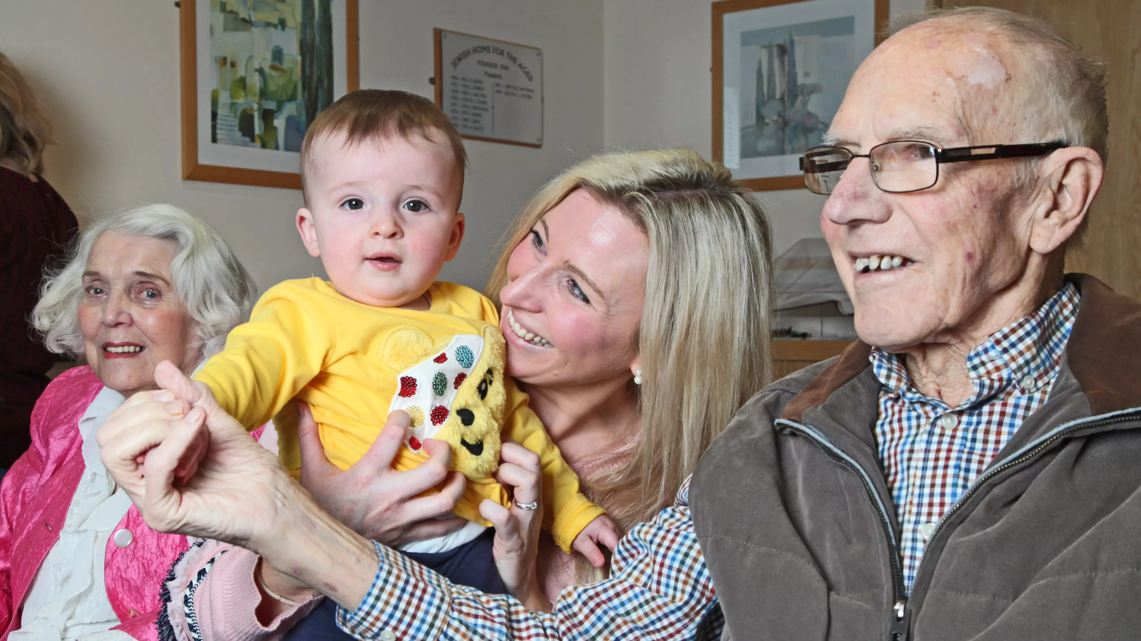 A Music Class For Babies Is Held In A Care Home To Help Dementia Patients