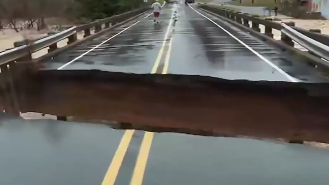 Bridge Splits During Live News Broadcast As Reporter Covers Impact Of Storm Eta