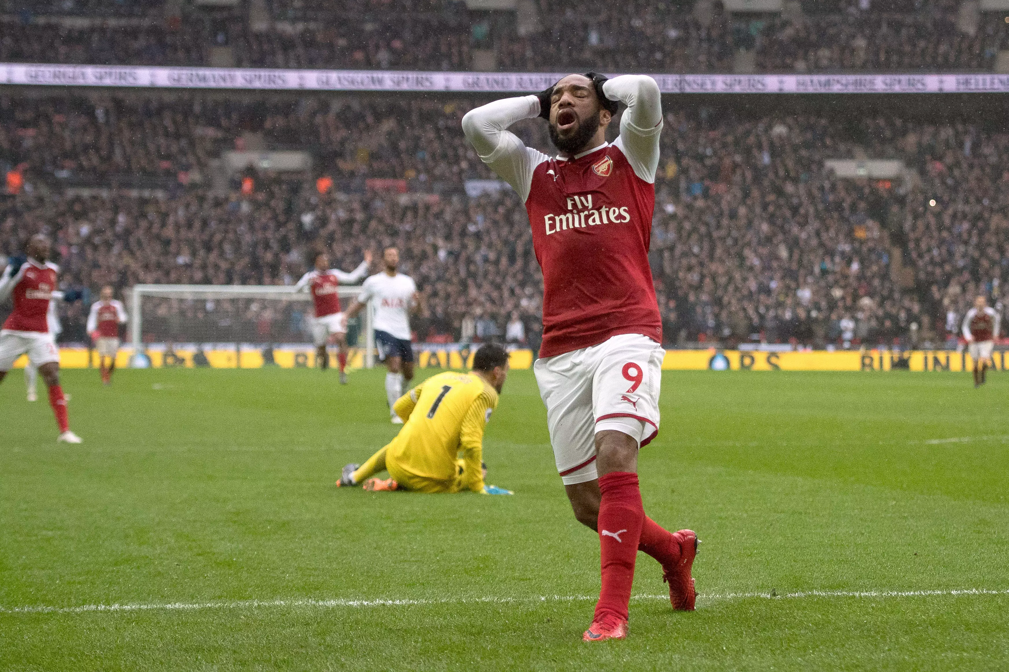 Lacazette cuts a dejected figure. Image: PA