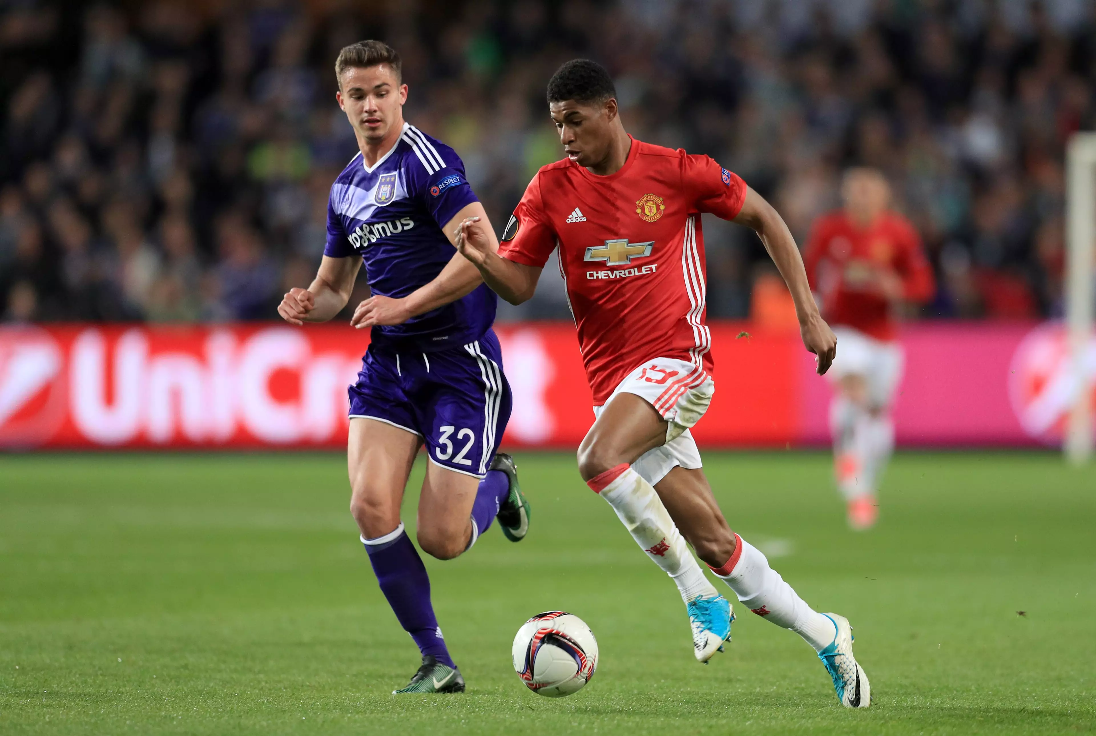 Dendoncker battles with Marcus Rashford for the ball. Image: PA Images.