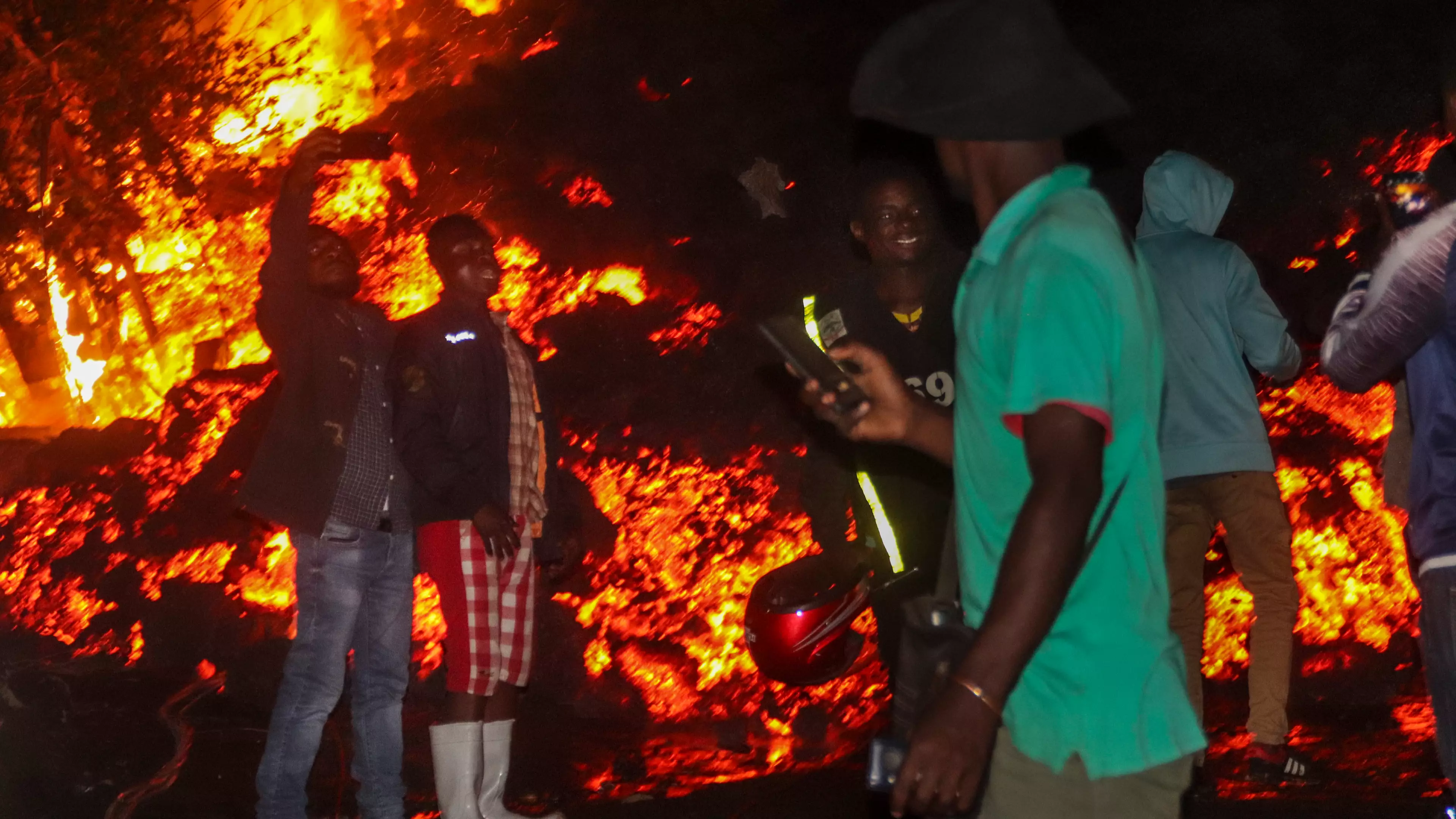 People Take Selfies In Front Of Burning Lava After Volcano Erupts