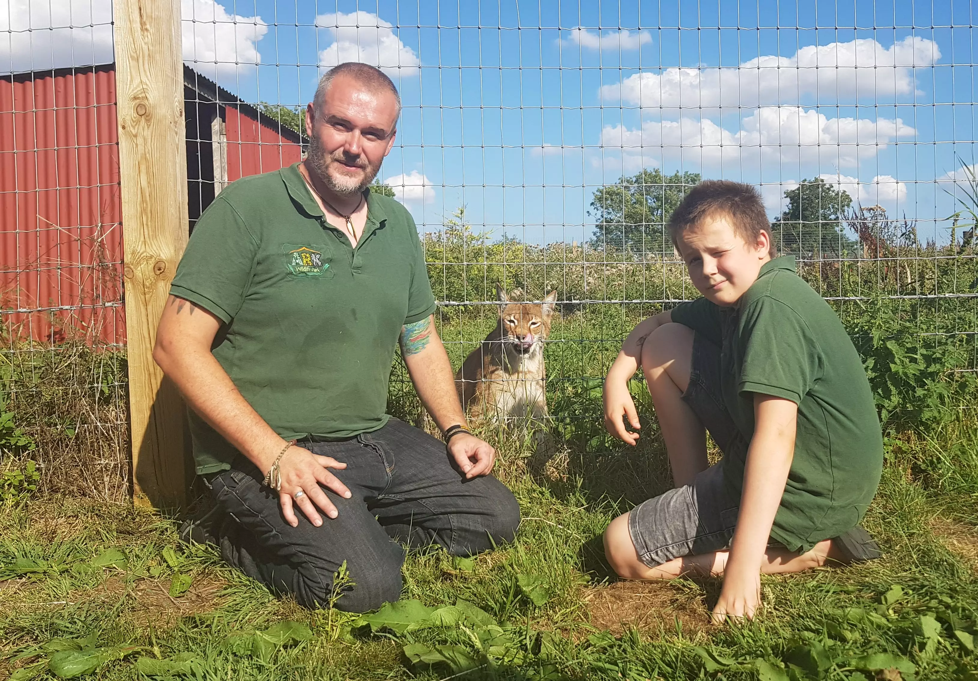 Jamie, pictured with son Josh, takes care of several wild cats and reptiles.