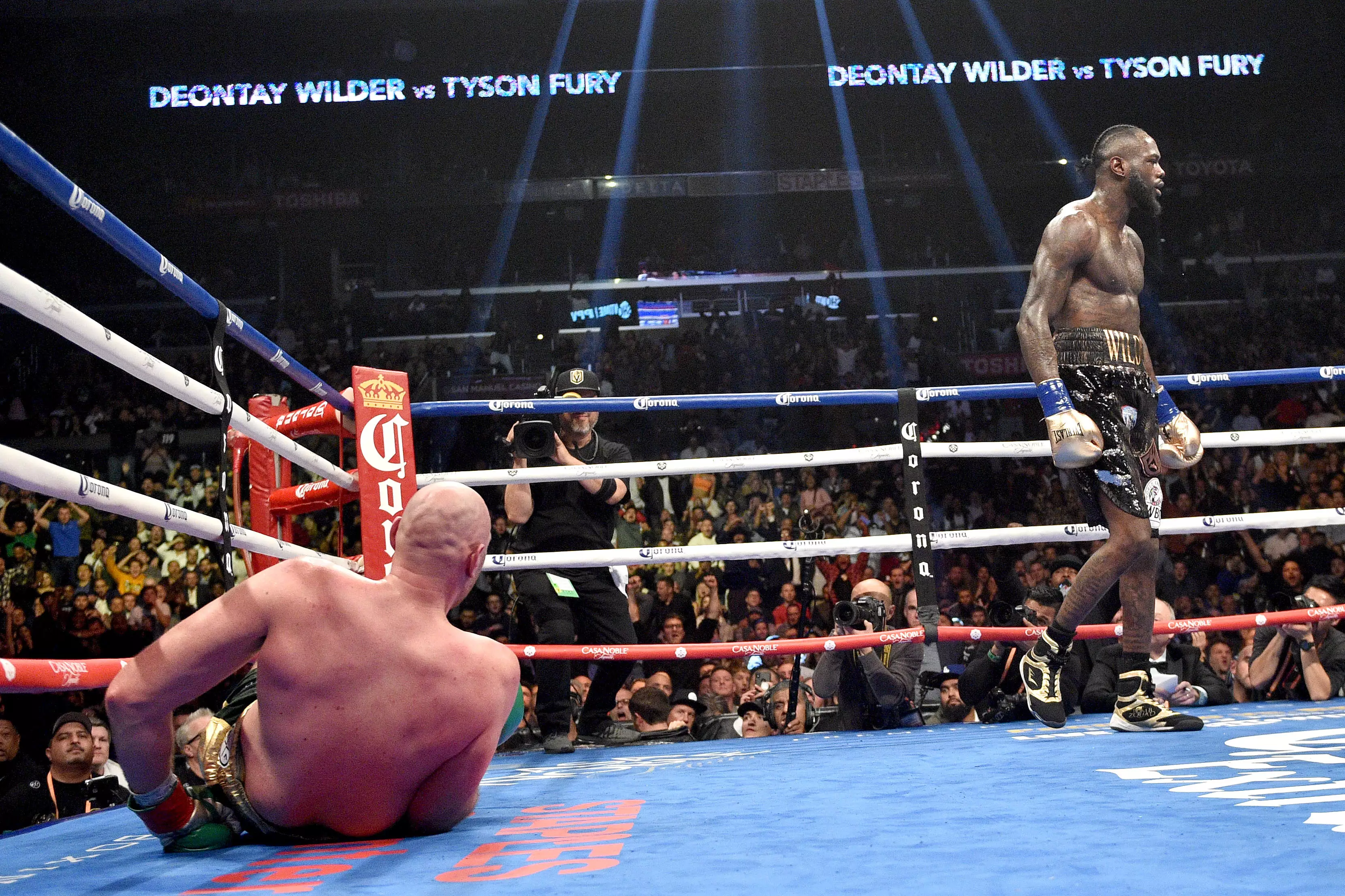 Wilder walks away after knocking Fury to the canvas in the 12th round. Image: PA Images