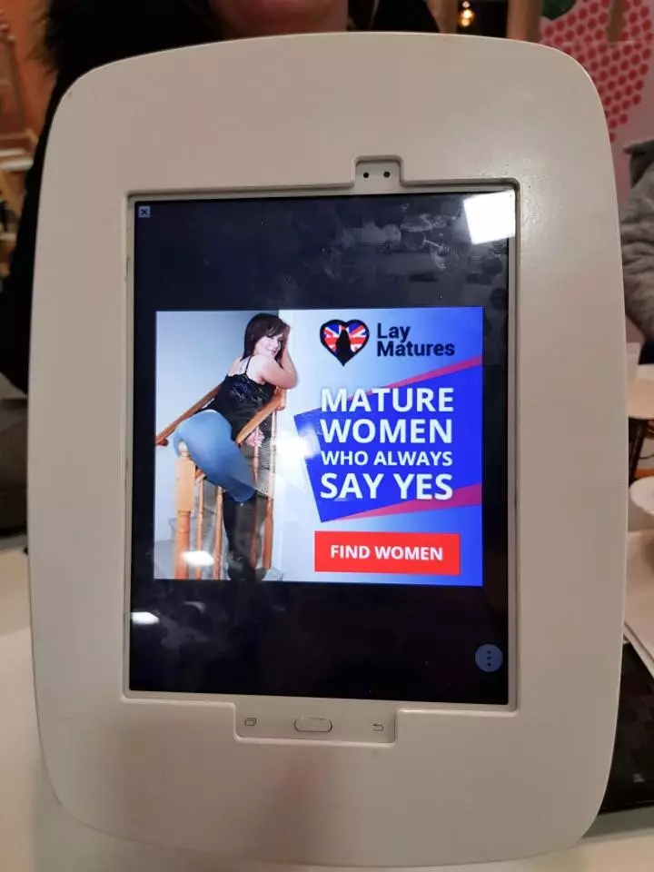 Adult dating adverts appeared on a McDonald's tablet.