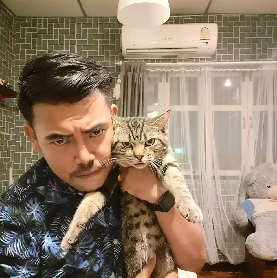 Lomphonten and his cat, Achi.