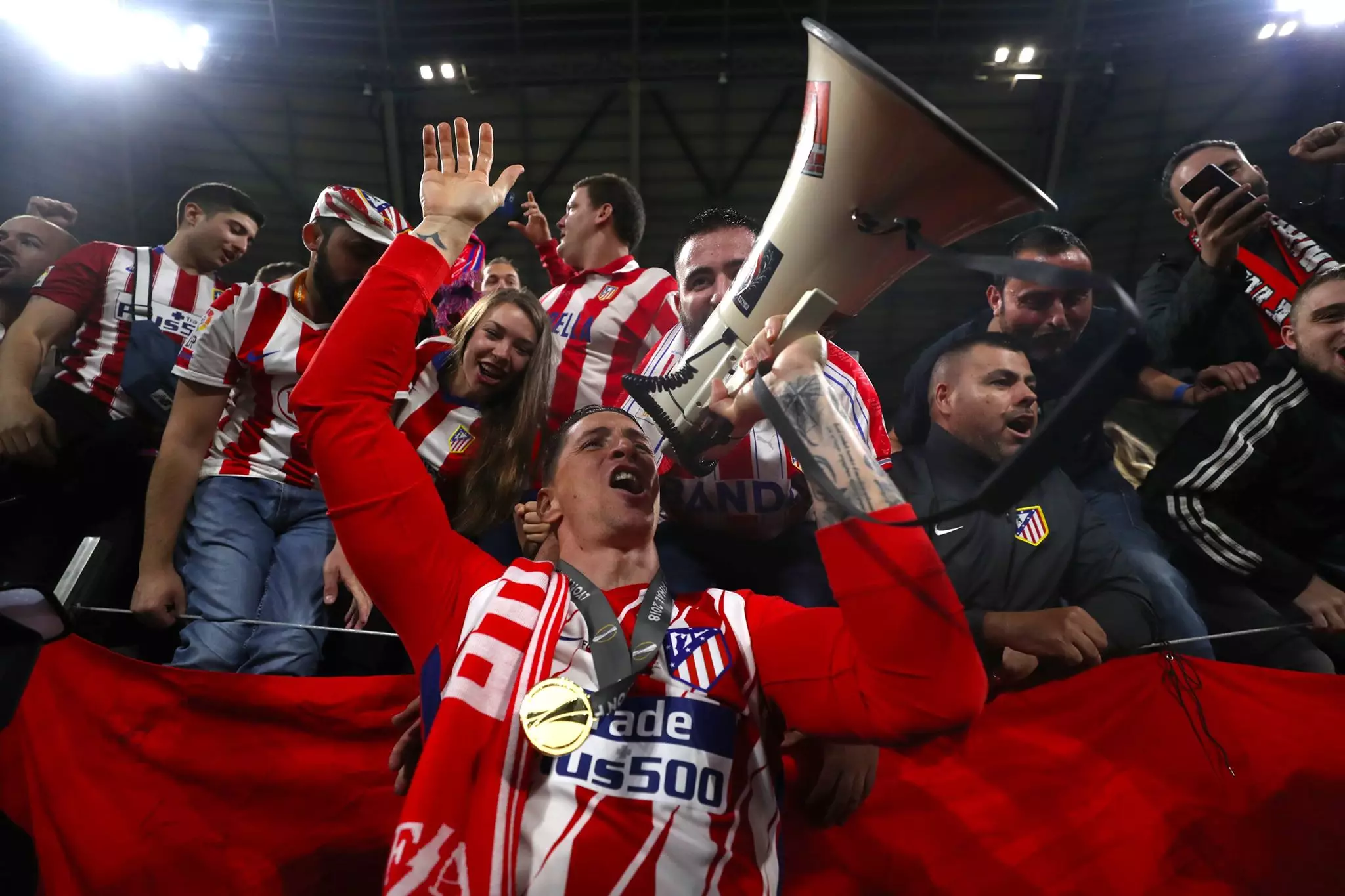 Torres celebrates with the fans. Image: PA