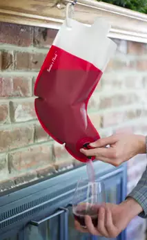The stocking has an easy use funnel to fill your glass whenever you please. (