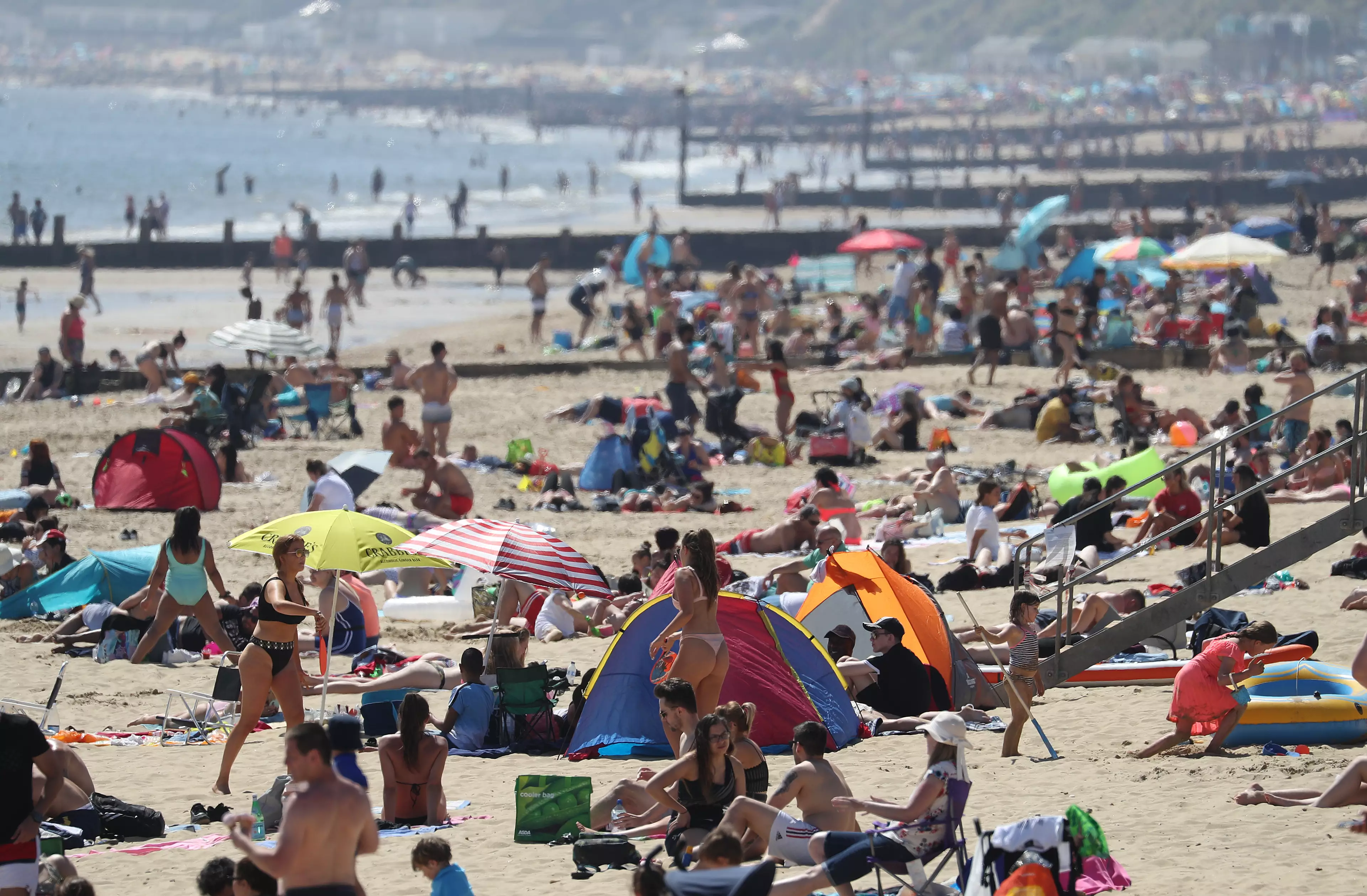 People flocked to enjoy the good weather at Bournemouth beach in Dorset.