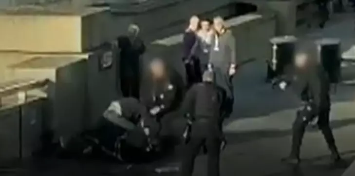 Darryn had to be dragged away by officers before Khan was shot dead.