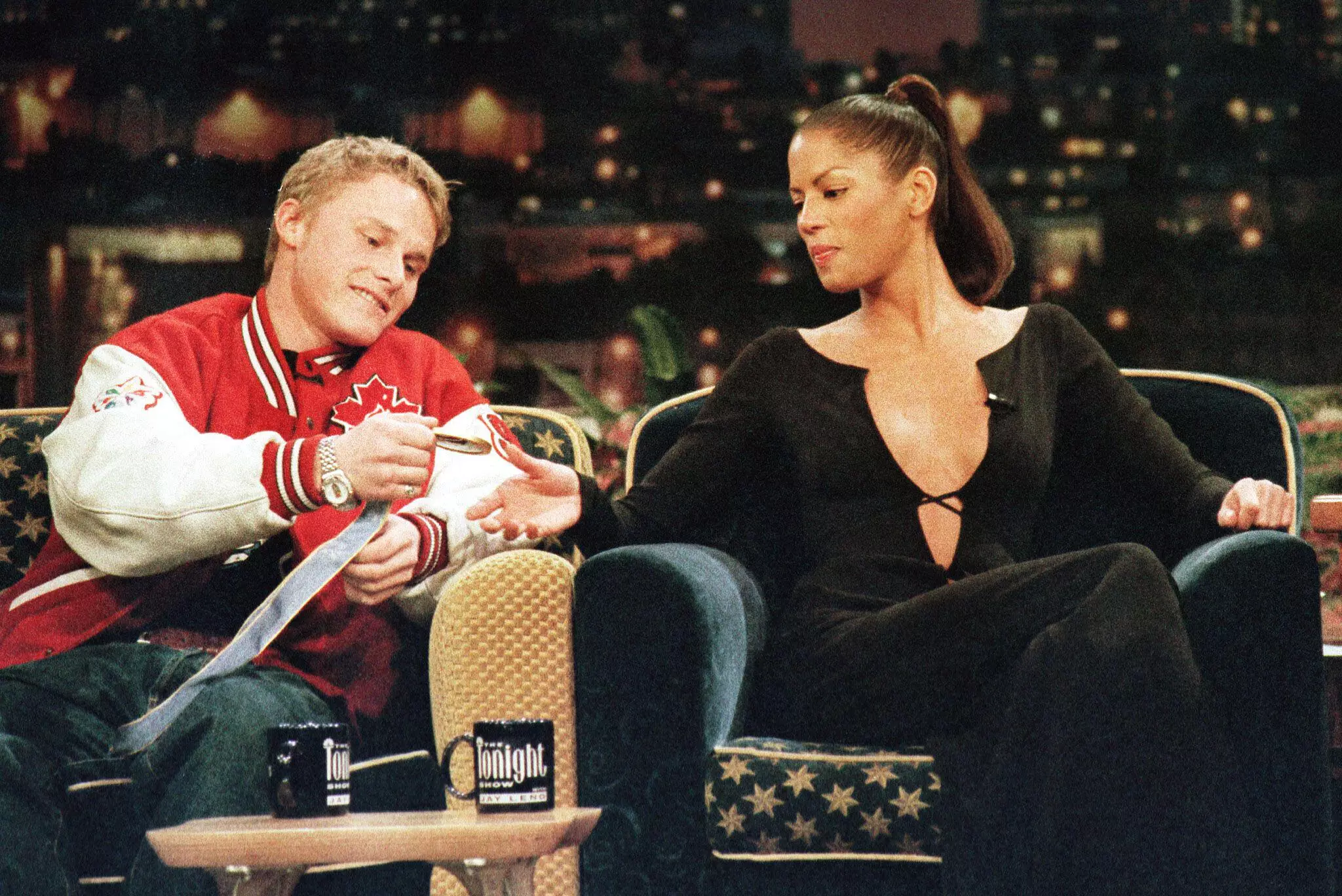Ross Rebagliati shows his medal to supermodel Veronica Webb on a TV show.