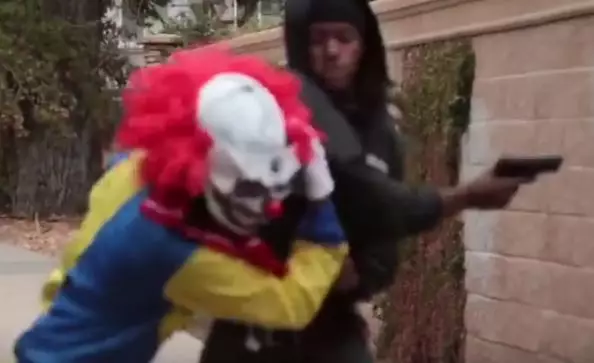 'Killer Clown' Prankster Gets Pistol Whipped For Messing With The Wrong Guy