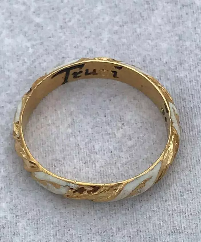 The ring is inscribed with the words 'Truth Betrayes Not'.