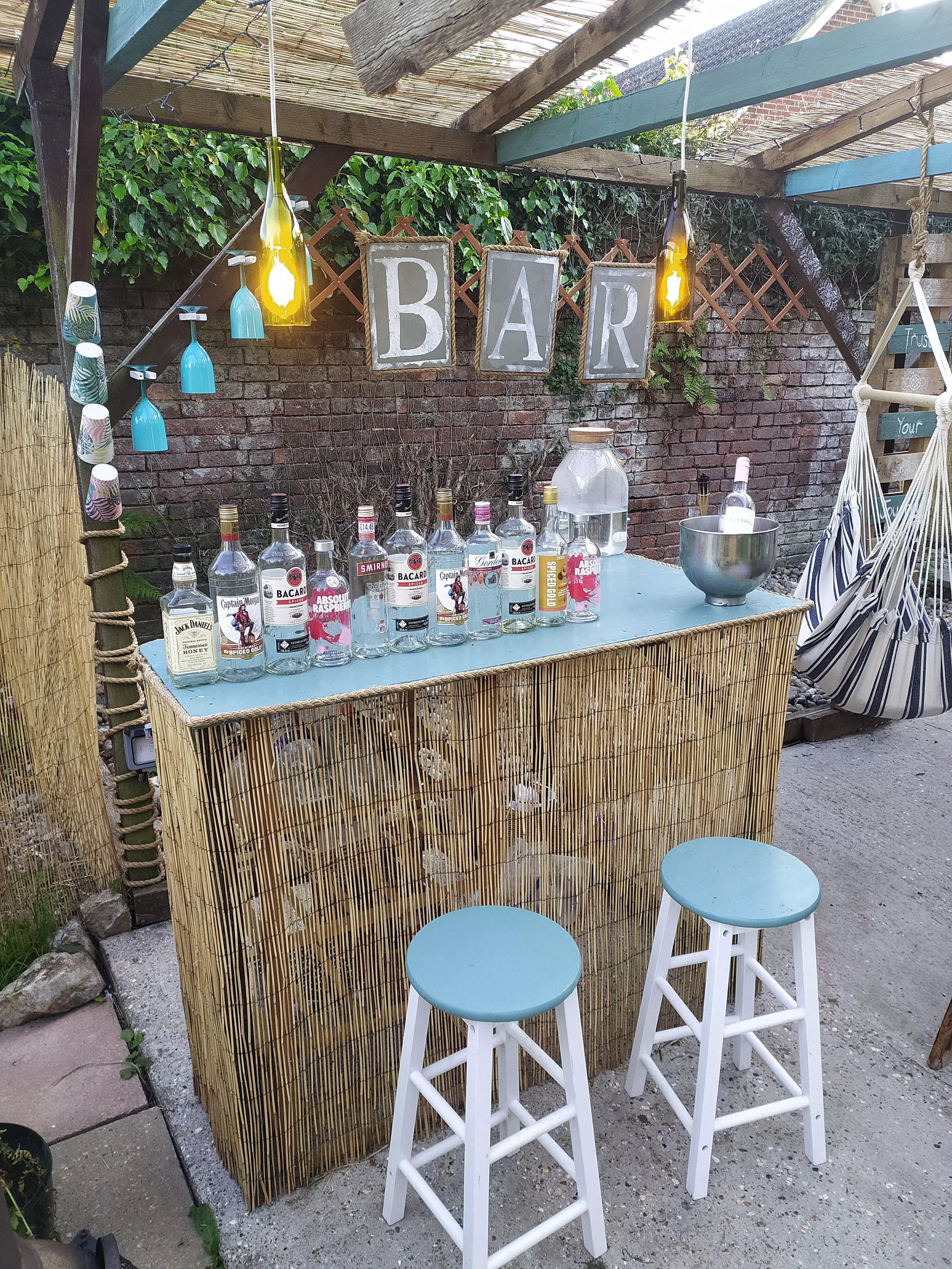The bar is installed, complete with bamboo fencing and plenty of drinks options! (