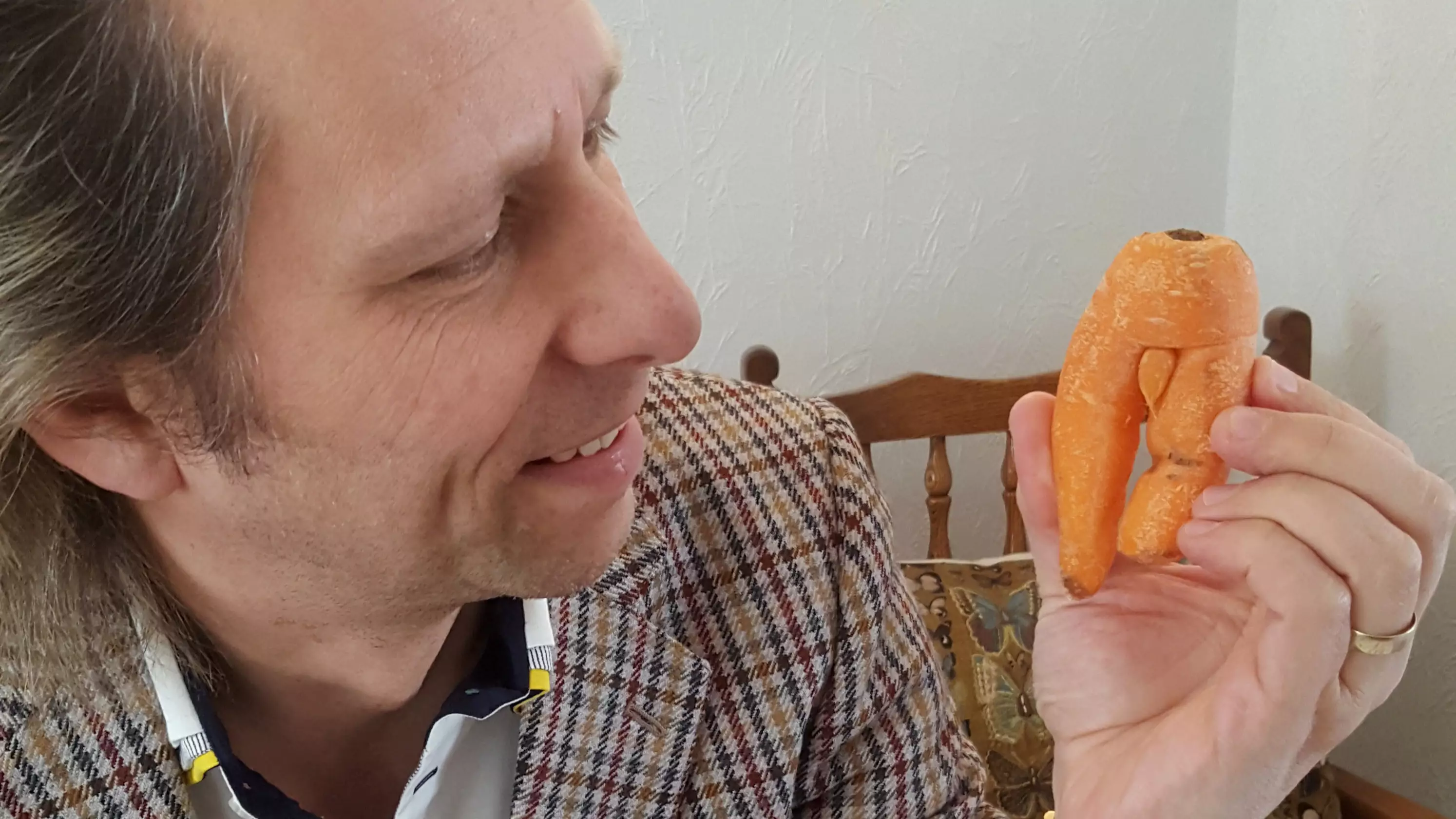 Man Refuses To Eat Rude Looking Carrot Because He Wants it As A Souvenir