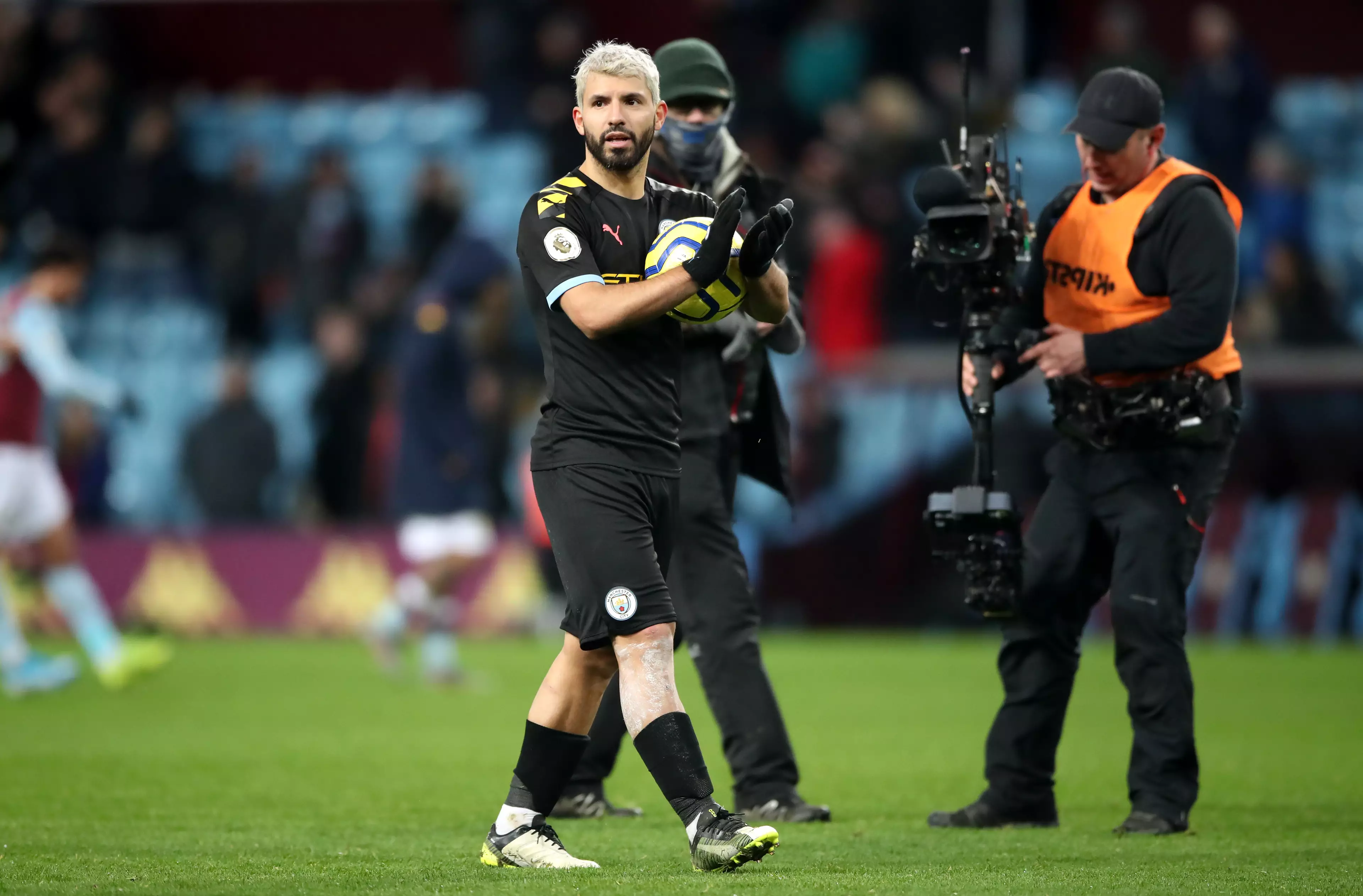 Aguero walks off with the match ball. Image: PA Images