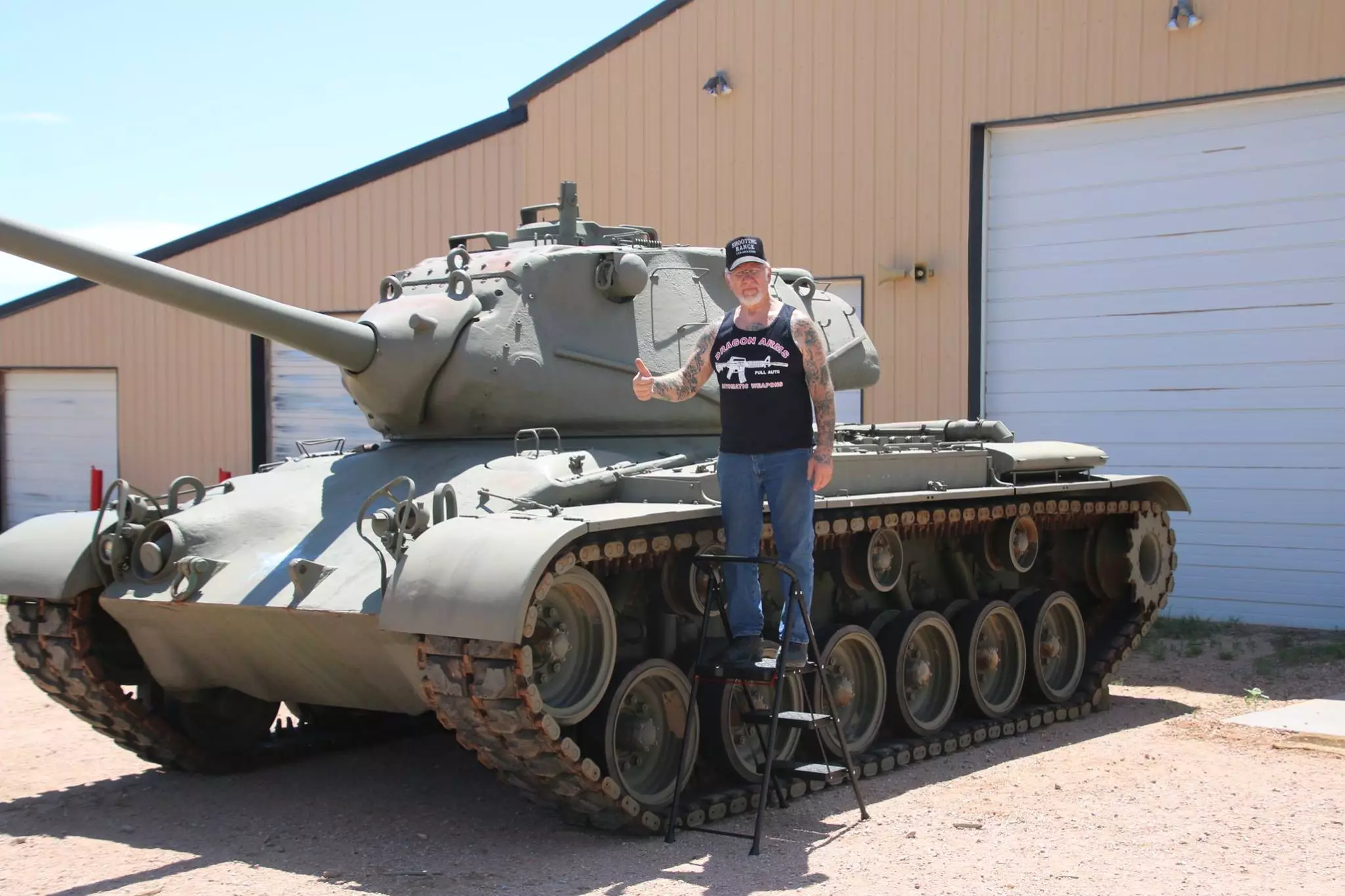 Mel standing next to his tank