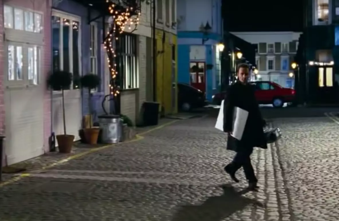You see the street in full when Mark walks away (