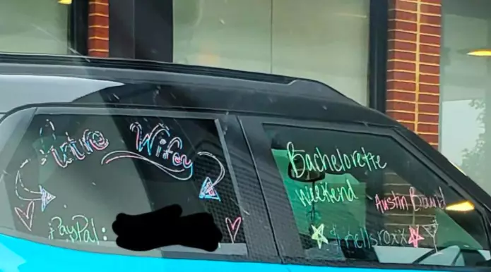 The car had the bride's PayPal number on so people could donate to her wedding (
