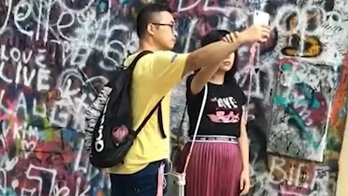 Woman Caught Using Her Boyfriend As A Tripod To Take Selfie 