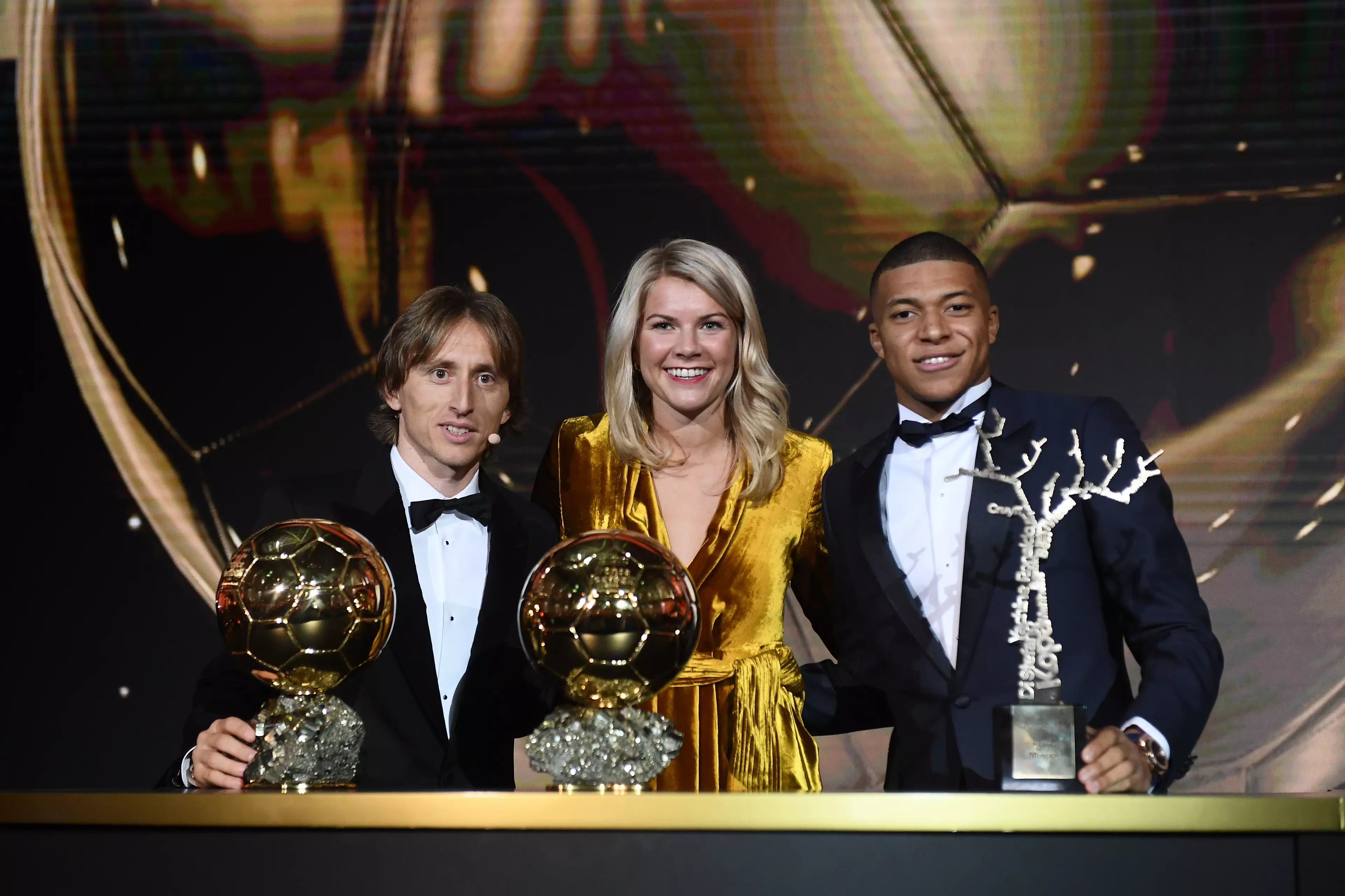 Modric with fellow award winners Ada Hegerberg and Kylian Mbappe. Image: PA Images
