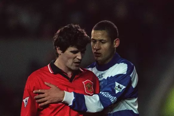 A young Quashie calms down Man Utd's Roy Keane during his QPR debut in 1995.