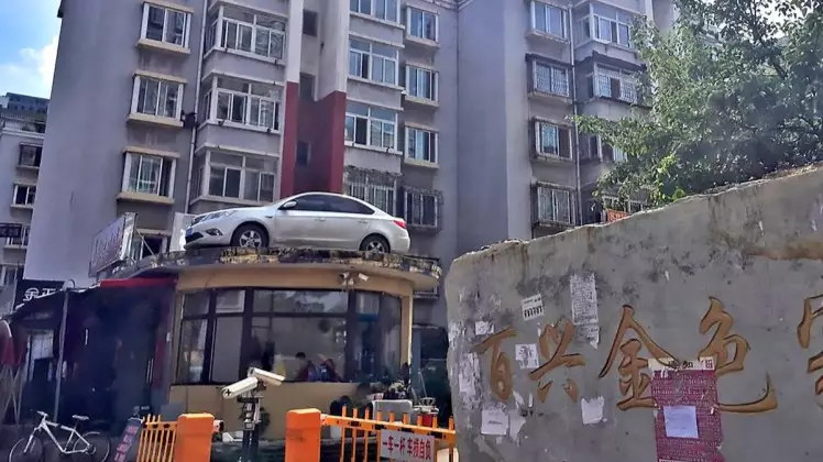 Crane Driver Lifts Up Illegally Parked Car And Dumps It On A Building 