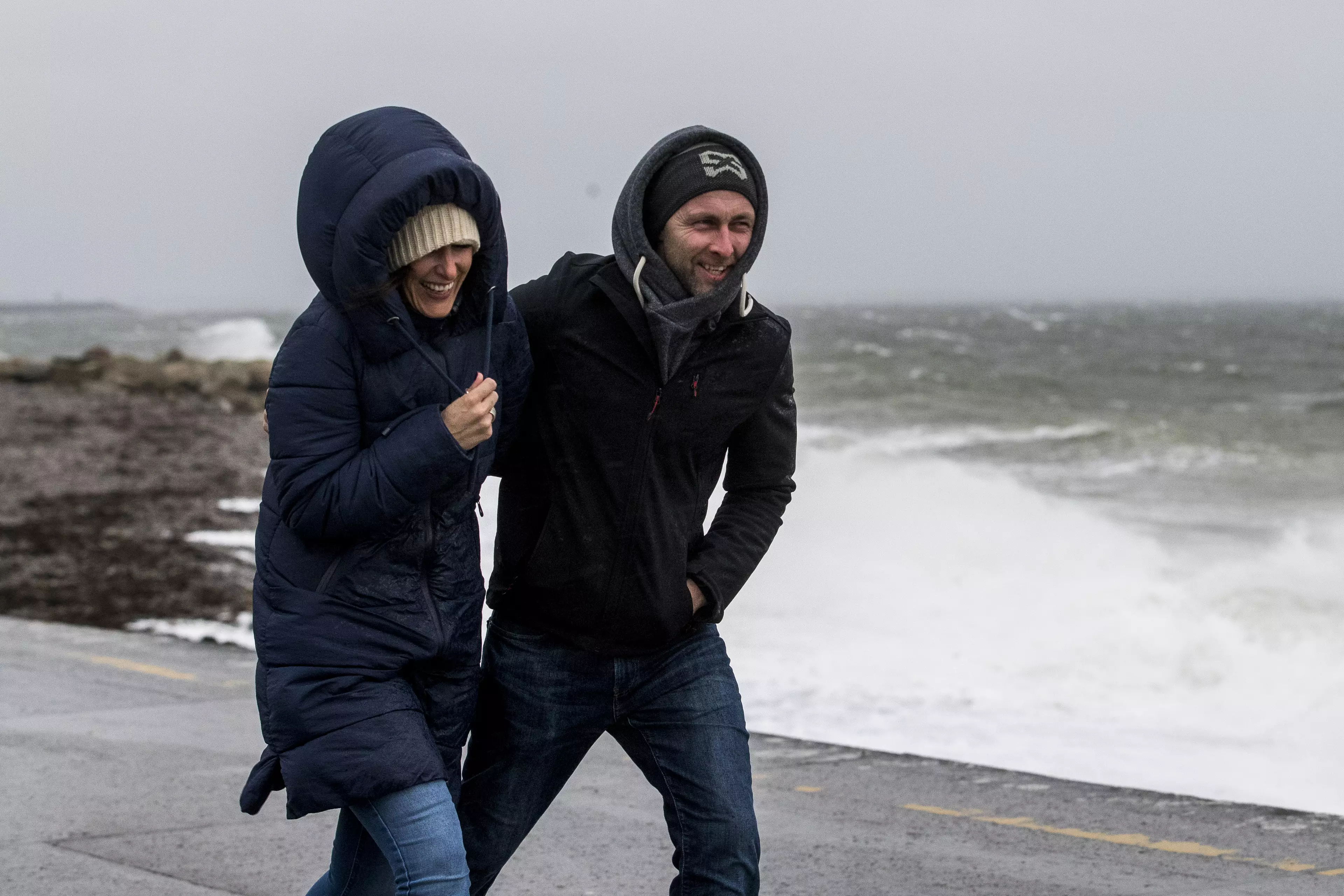 Two walkers on the coast in Co. Galway in Ireland are battered by Storm Ciara.