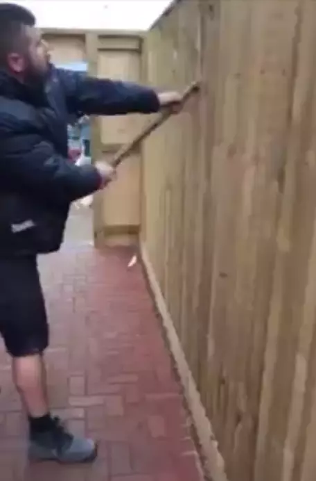Workmen rip through a fence after the customer allegedly failed to pay.