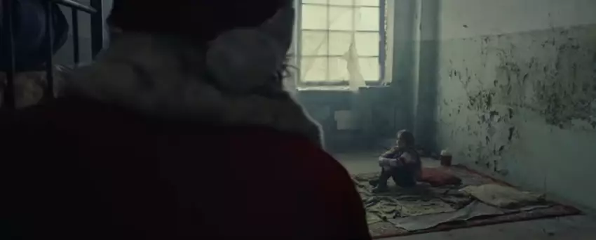 During the advert Santa finds a missing child in an abandoned building. (