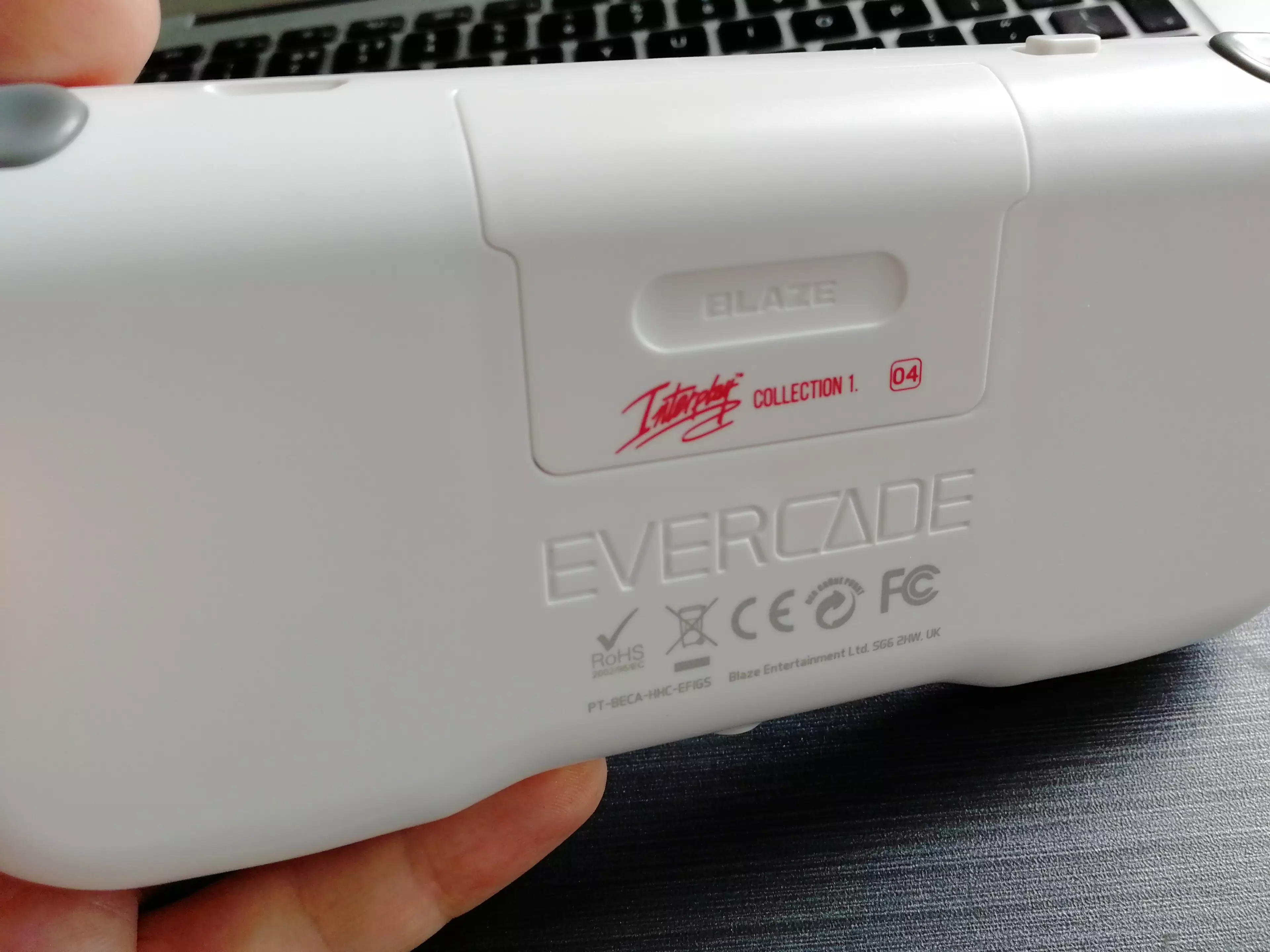 The back of the Evercade, with a cartridge inserted