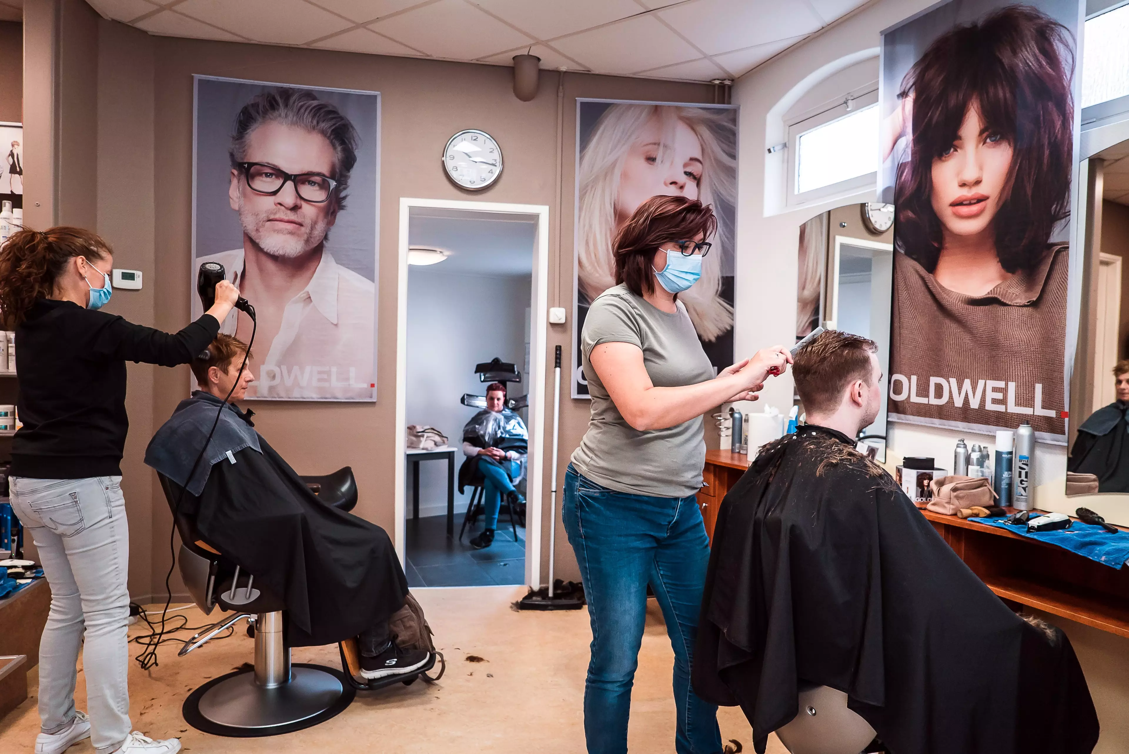 A salon in the Netherlands, where staff are required to wear face coverings but clients are mask-free (