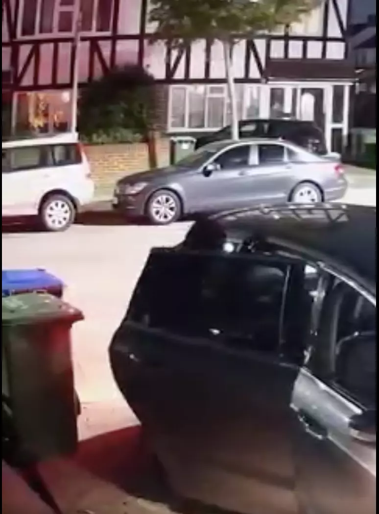 Thug smashes door open and begins to pour flammable liquid into the car.