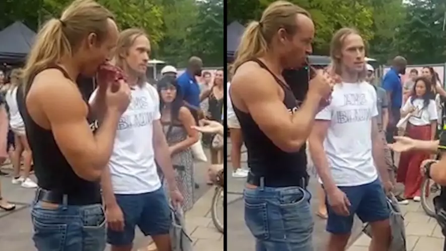 Man Casually Eats Raw Steak Dripping With Blood Outside Vegan Festival