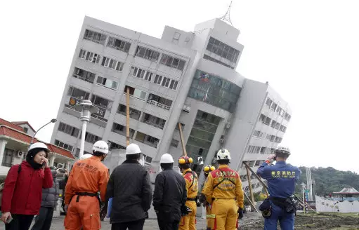 Workers survey the damage from the Taiwanese earthquake.