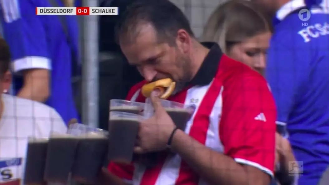 Football Fan Carrying At Least Seven Pints And A Hotdog Is Our New Hero